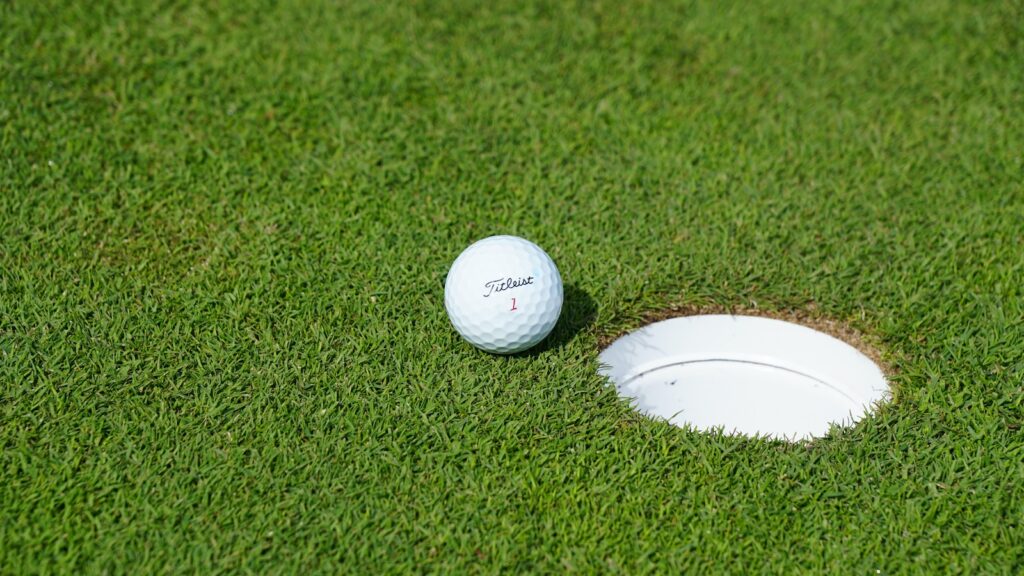 white golf ball on green grass field