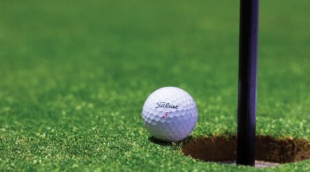 white golf ball on green grass field during daytime